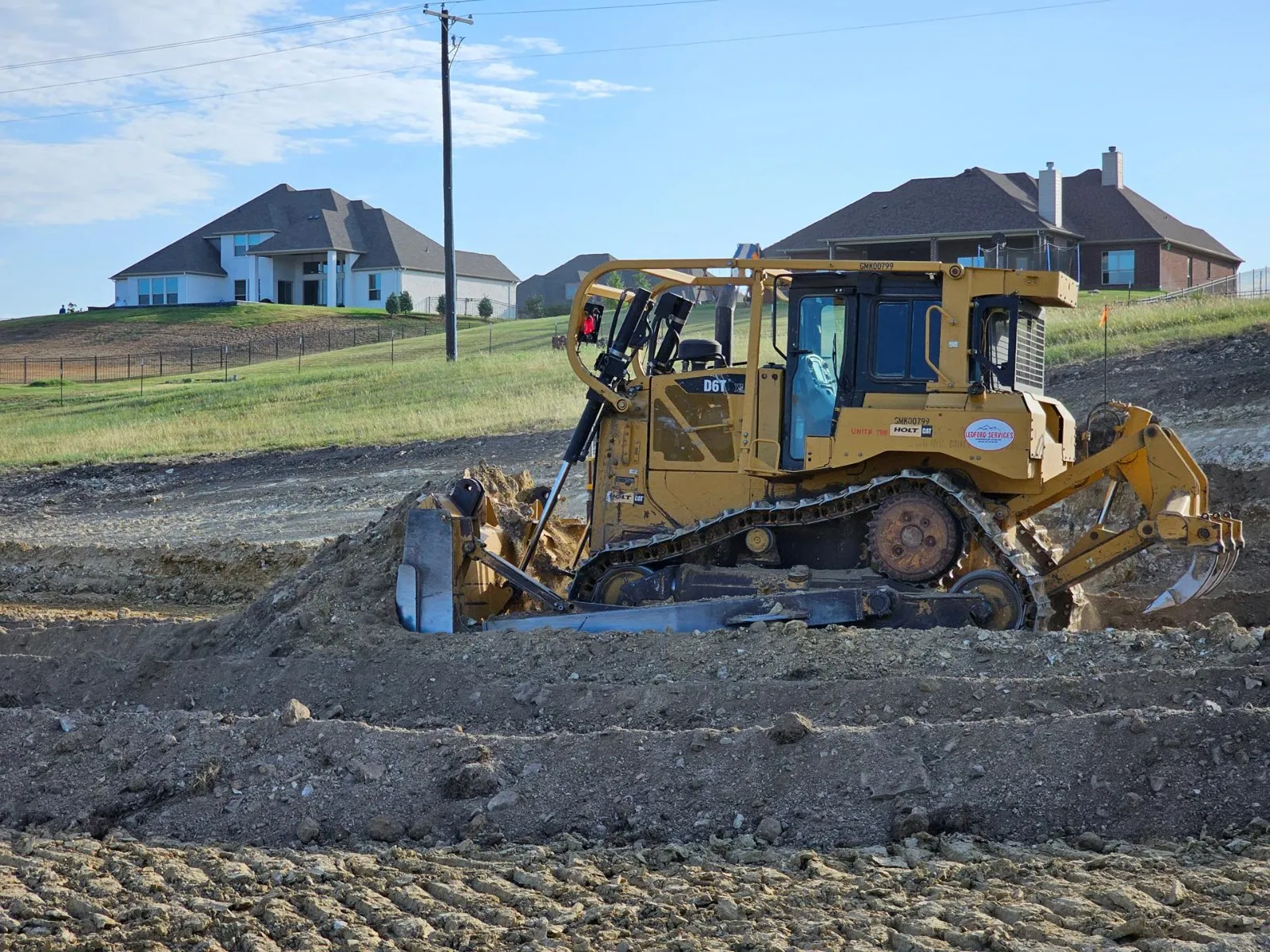 Ledford Services CAT dozer grading a development pad
