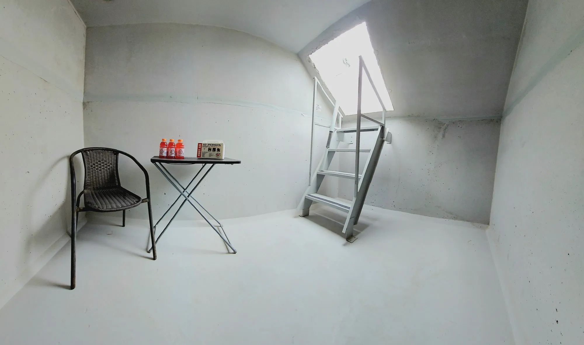 Interior of an installed Ledford storm shelter, finished and furnished