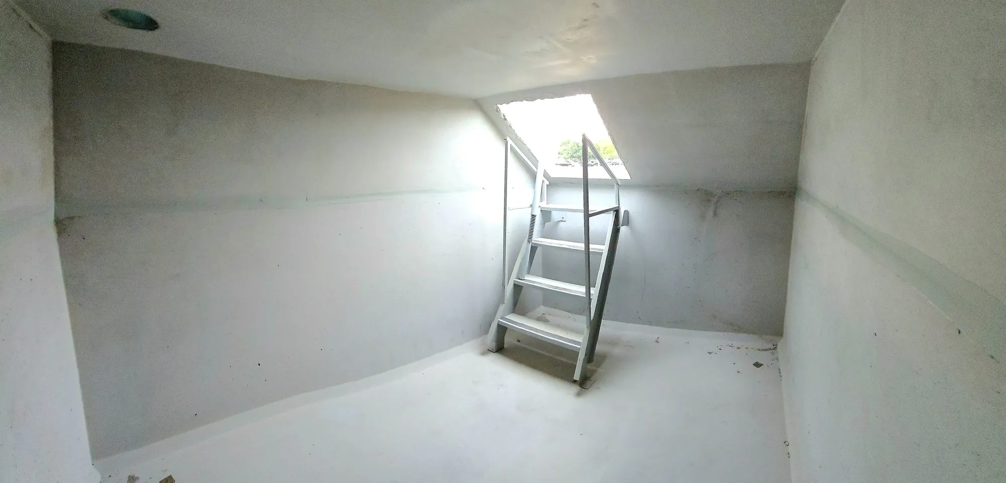 Inside a Ledford storm shelter looking back up the steps to daylight