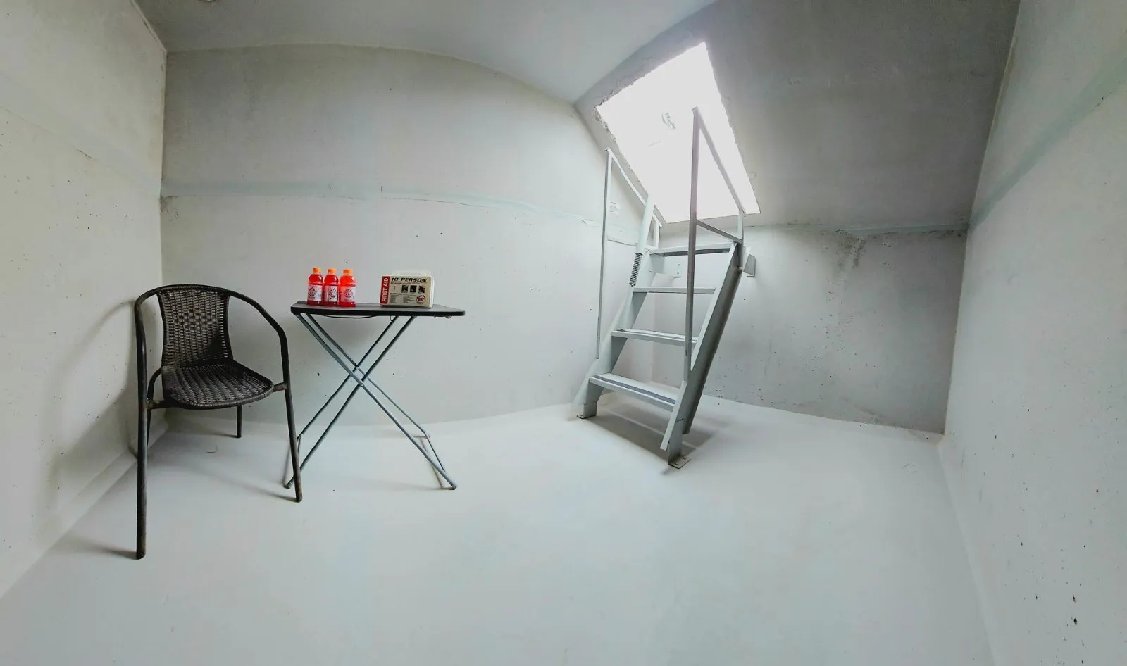 Interior of an in-ground storm shelter with ladder